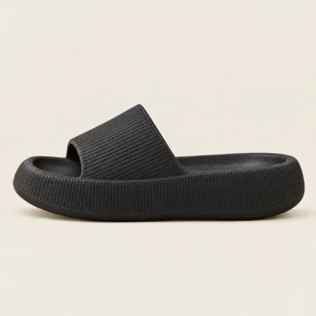 Cloud Slides in Black, side view showing the thick cushioned sole